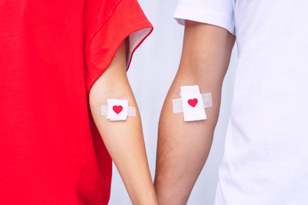 Blood donation. Blood donors with bandage after giving blood. High quality photo